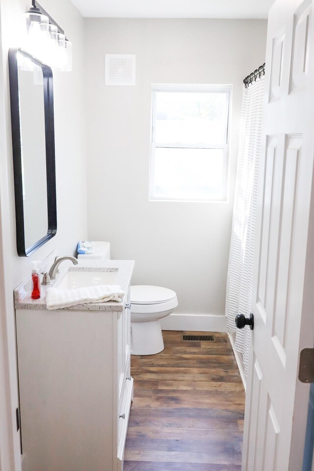413 E Main St, Waverly, TN 37185 - bathroom featuring vanity and wood finished floors
