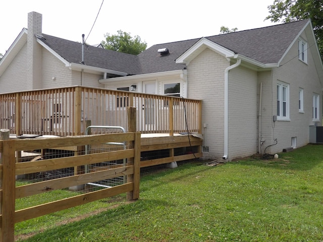 413 E Main St, Waverly, TN 37185 - rear view of property with brick siding, roof with shingles, a chimney, and a deck