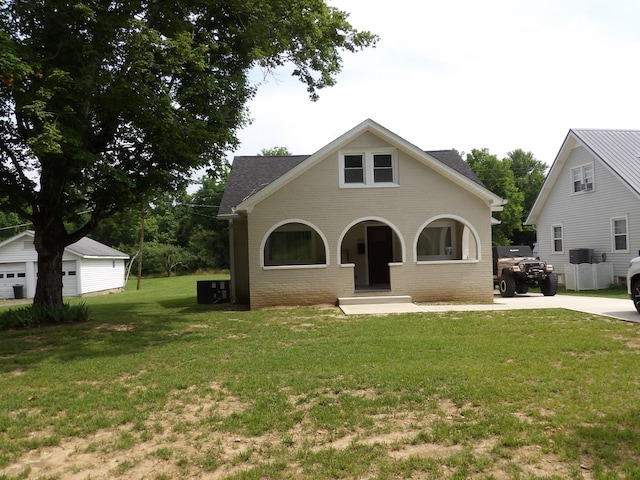 413 E Main St, Waverly, TN 37185 - view of front of property featuring brick siding, a front lawn, and a shingled roof