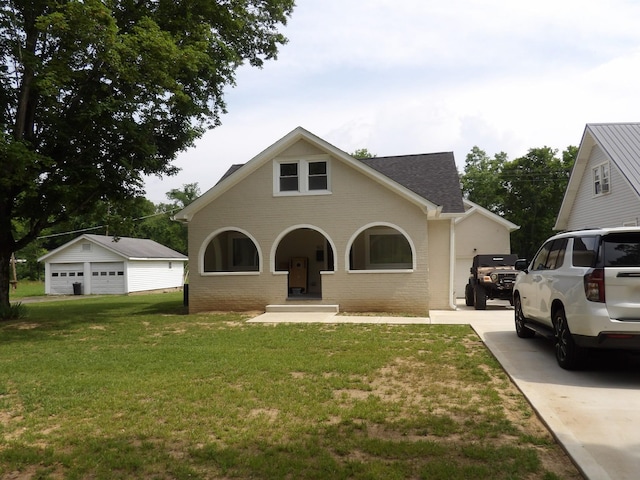 413 E Main St, Waverly, TN 37185 - traditional-style house featuring a front lawn, an outbuilding, concrete driveway, brick siding, and roof with shingles