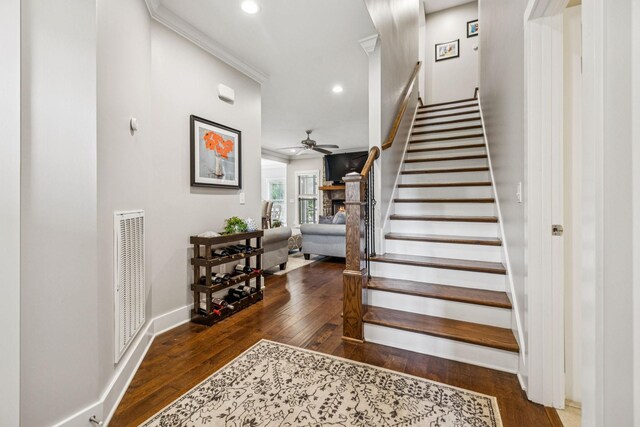 146 Island Way, Winchester, TN 37398 - staircase featuring a ceiling fan, hardwood / wood-style floors, recessed lighting, a stone fireplace, and crown molding