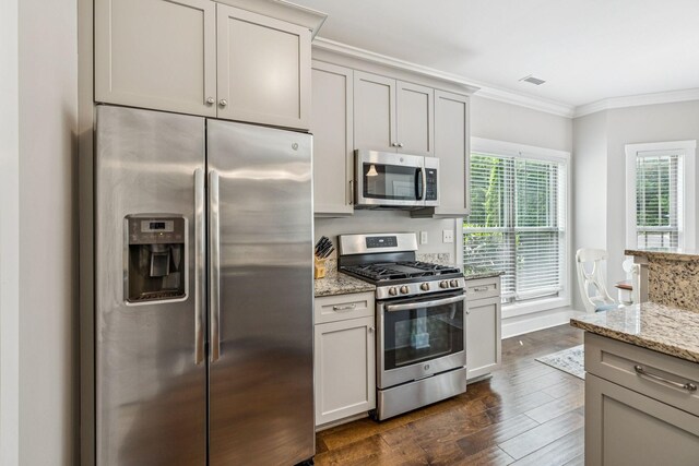 146 Island Way, Winchester, TN 37398 - kitchen featuring stainless steel appliances, dark wood-style floors, crown molding, and light stone countertops