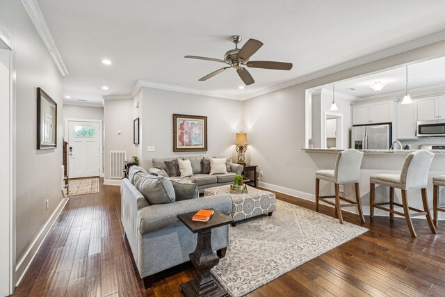 146 Island Way, Winchester, TN 37398 - living area with dark wood-style flooring, recessed lighting, ceiling fan, and crown molding