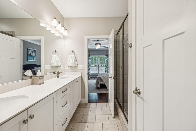 146 Island Way, Winchester, TN 37398 - bathroom with connected bathroom, double vanity, a shower with shower door, and tile patterned floors