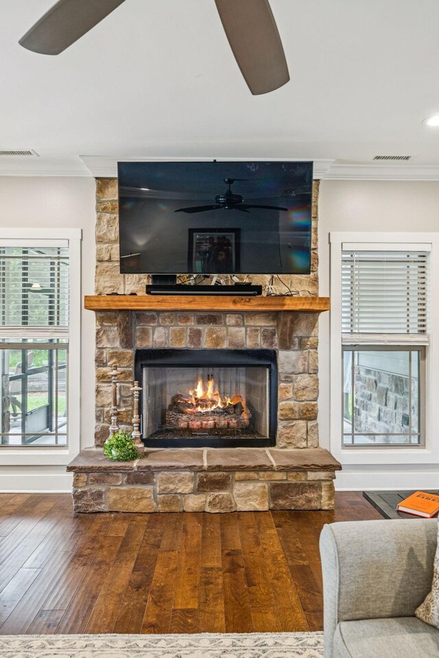 146 Island Way, Winchester, TN 37398 - detailed view of a stone fireplace, ornamental molding, wood finished floors, and a ceiling fan