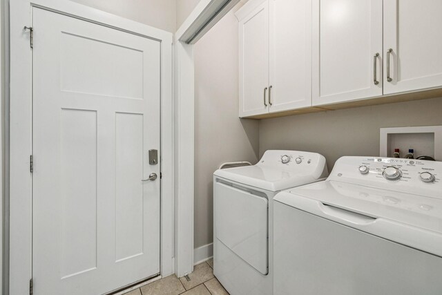146 Island Way, Winchester, TN 37398 - laundry room featuring cabinet space, washing machine and clothes dryer, and light tile patterned floors