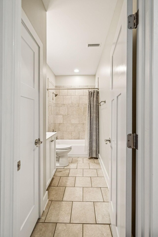 146 Island Way, Winchester, TN 37398 - bathroom featuring vanity, tile patterned floors, and shower / bath combo with shower curtain