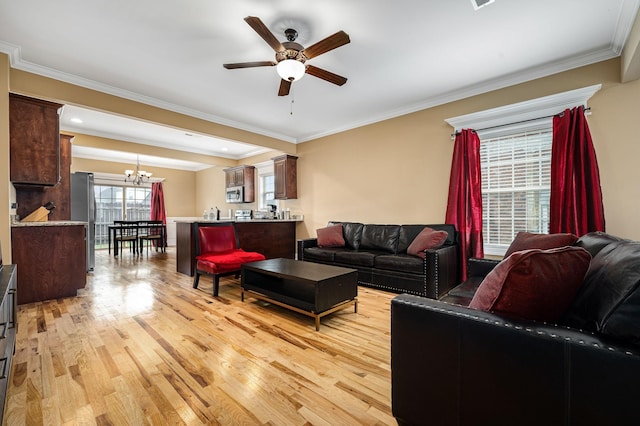 2816 Lightning Bug Dr, Murfreesboro, TN 37129 - living room with a ceiling fan, light wood-style flooring, a chandelier, and ornamental molding