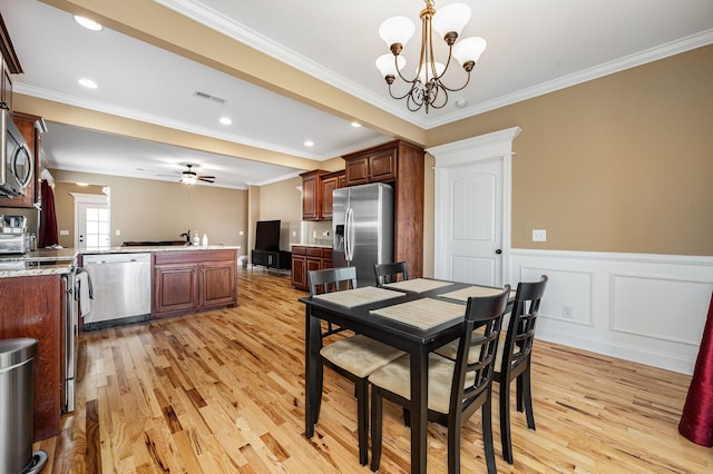 2816 Lightning Bug Dr, Murfreesboro, TN 37129 - dining space featuring light wood-style floors, a chandelier, crown molding, a wainscoted wall, and recessed lighting