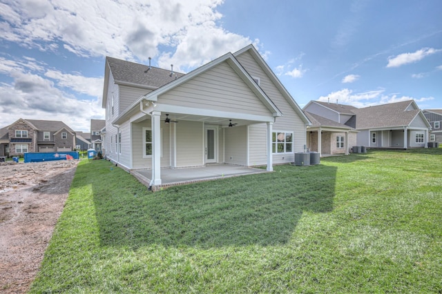 4025 Singing Creek Dr, Franklin, TN 37064 - rear view of property featuring ceiling fan, a patio, a lawn, and roof with shingles