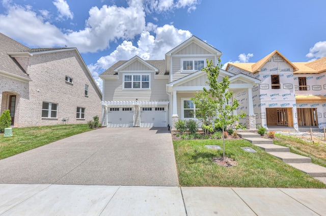 4025 Singing Creek Dr, Franklin, TN 37064 - view of front facade with board and batten siding, driveway, an attached garage, and a front lawn