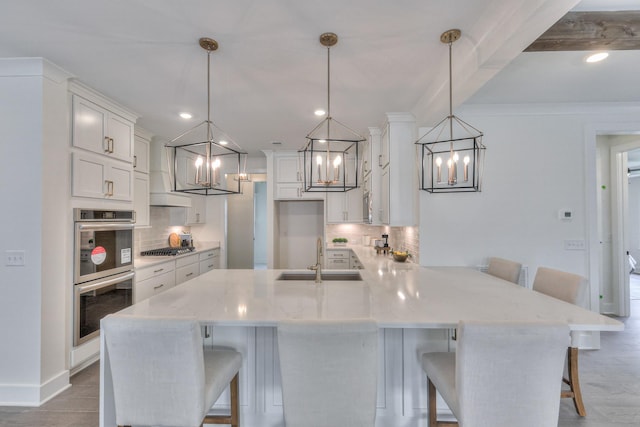4025 Singing Creek Dr, Franklin, TN 37064 - kitchen featuring stainless steel appliances, tasteful backsplash, a kitchen breakfast bar, and recessed lighting