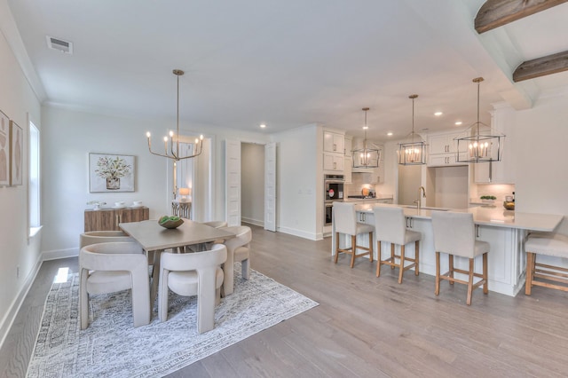 4025 Singing Creek Dr, Franklin, TN 37064 - dining area with a chandelier, recessed lighting, light wood-style flooring, and crown molding
