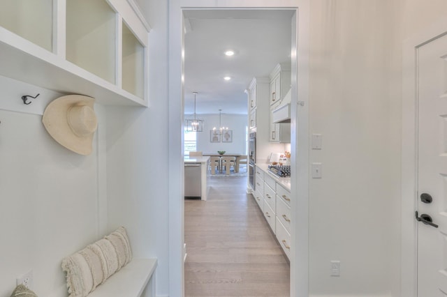 4025 Singing Creek Dr, Franklin, TN 37064 - hallway featuring light wood-type flooring, recessed lighting, and a chandelier
