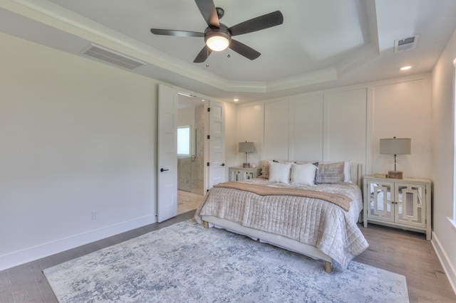 4025 Singing Creek Dr, Franklin, TN 37064 - bedroom with a raised ceiling, wood finished floors, recessed lighting, ceiling fan, and ensuite bathroom