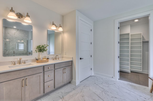 4025 Singing Creek Dr, Franklin, TN 37064 - bathroom featuring double vanity, marble look tiles, a marble finish shower, and a walk in closet
