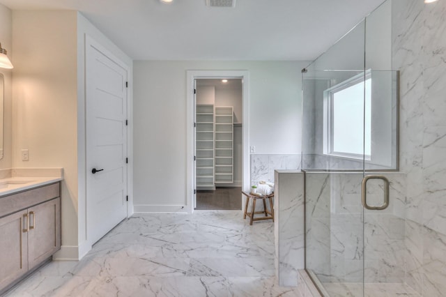 4025 Singing Creek Dr, Franklin, TN 37064 - bathroom featuring vanity, a marble finish shower, marble finish flooring, a walk in closet, and recessed lighting