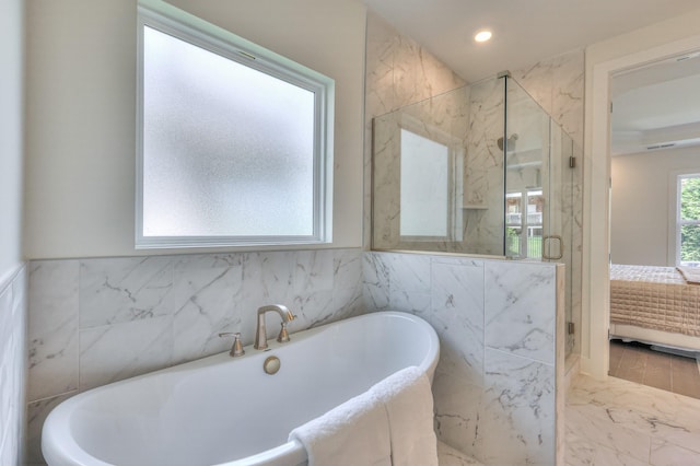 4025 Singing Creek Dr, Franklin, TN 37064 - ensuite bathroom with tile walls, a marble finish shower, a soaking tub, marble tiled flooring, and recessed lighting