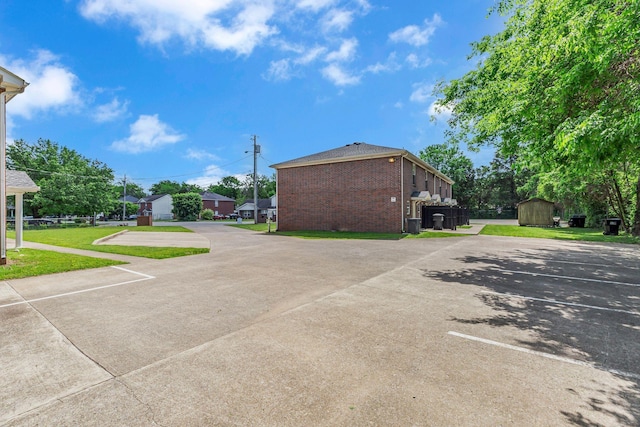 1505 Center Pointe Dr, Murfreesboro, TN 37130 - uncovered parking lot featuring a storage unit