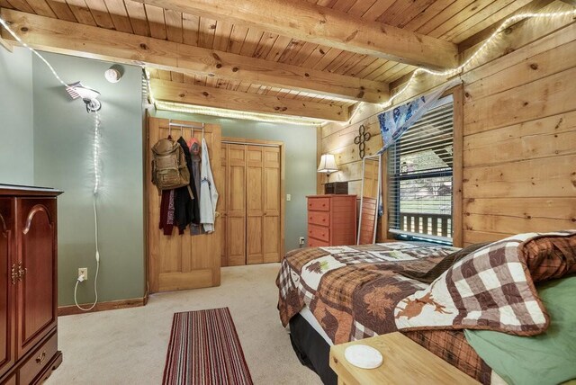 2875 Stage Coach Rd, Sewanee, TN 37375 - bedroom with a wooden ceiling with exposed beams, light colored carpet, wood walls, and a closet