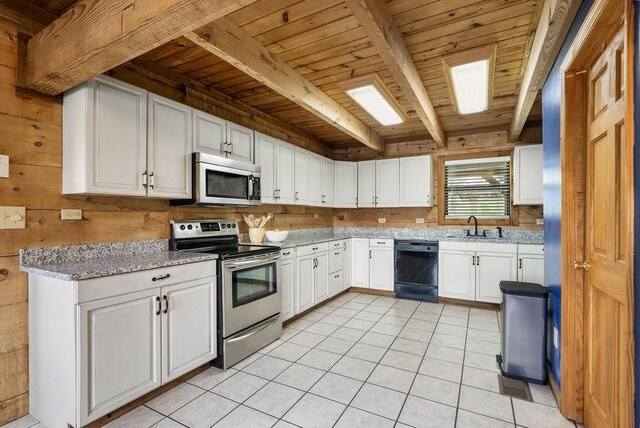 2875 Stage Coach Rd, Sewanee, TN 37375 - kitchen featuring stainless steel appliances, a wooden ceiling with exposed beams, light tile patterned flooring, white cabinetry, and light stone countertops
