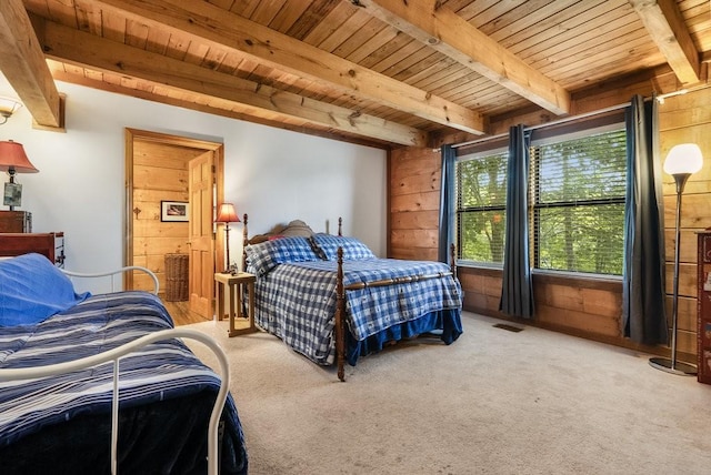 2875 Stage Coach Rd, Sewanee, TN 37375 - bedroom with a wooden ceiling with exposed beams, wood walls, carpet floors, and ensuite bath