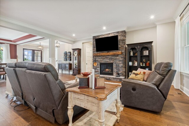 6013 Blackwell Ln, Franklin, TN 37064 - living room featuring a fireplace, wood finished floors, crown molding, and recessed lighting