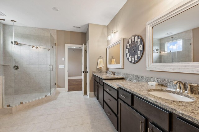 6013 Blackwell Ln, Franklin, TN 37064 - full bath featuring double vanity, a shower stall, and tile patterned floors