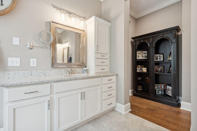 6013 Blackwell Ln, Franklin, TN 37064 - bathroom with ornamental molding, vanity, and wood finished floors