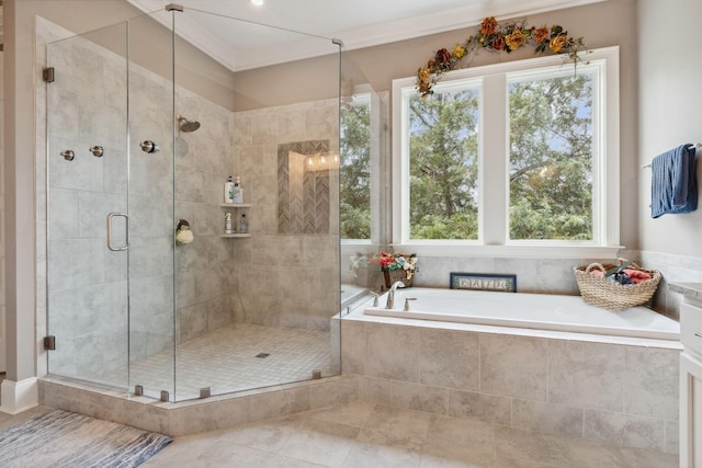 6013 Blackwell Ln, Franklin, TN 37064 - full bath featuring healthy amount of natural light, a garden tub, a shower stall, tile patterned floors, and ornamental molding
