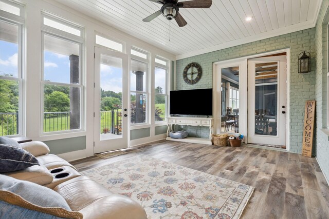 6013 Blackwell Ln, Franklin, TN 37064 - living area featuring brick wall, wooden ceiling, a ceiling fan, crown molding, and wood finished floors