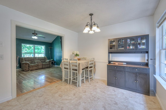 168 N Wagon Trl, Murfreesboro, TN 37128 - dining space featuring a chandelier, ceiling fan, and a textured ceiling