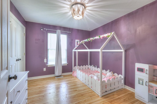 168 N Wagon Trl, Murfreesboro, TN 37128 - bedroom featuring wood finished floors and a chandelier
