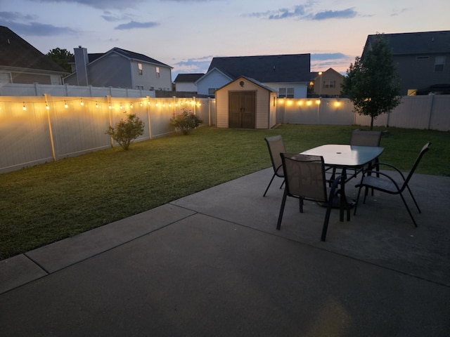1736 Bellamy Ln, Murfreesboro, TN 37128 - fenced backyard featuring a patio, a storage unit, and outdoor dining space