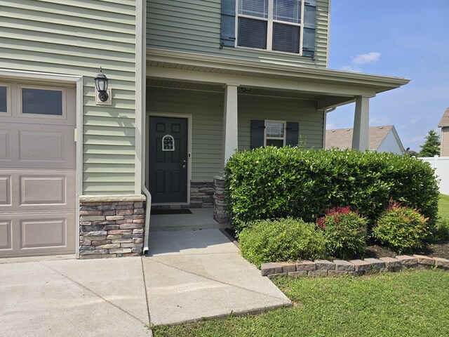 1736 Bellamy Ln, Murfreesboro, TN 37128 - view of exterior entry featuring a porch and stone siding