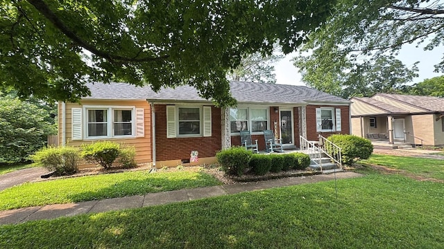 206 S Meadow Cir, Clarksville, TN 37043 - view of front of home with a front lawn, covered porch, and brick siding