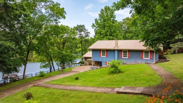 554 Hickman Shores Rd, Dover, TN 37058 - single story home with a metal roof and a water view