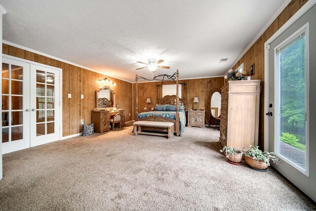 554 Hickman Shores Rd, Dover, TN 37058 - carpeted bedroom featuring multiple windows, wood walls, french doors, access to exterior, and ornamental molding