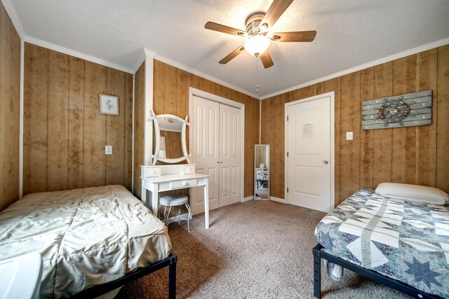 554 Hickman Shores Rd, Dover, TN 37058 - carpeted bedroom with ornamental molding, a textured ceiling, wood walls, and a ceiling fan