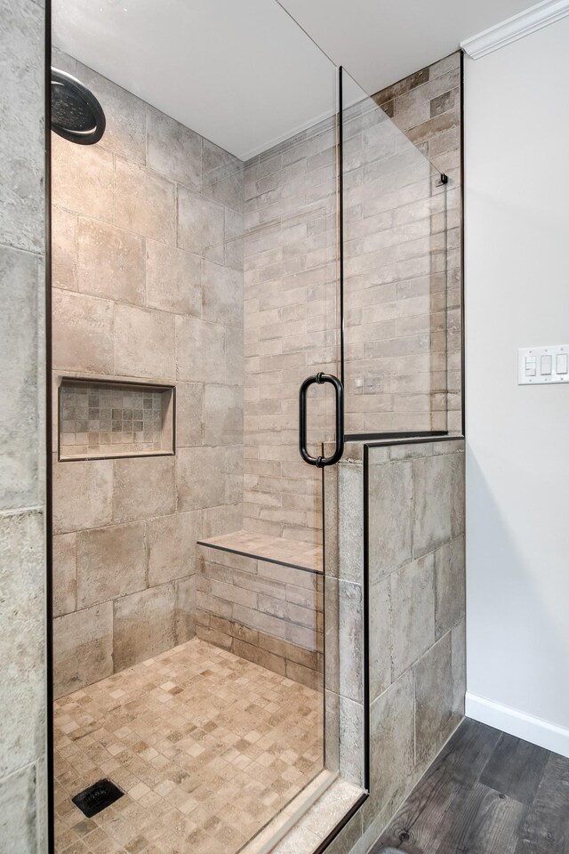 554 Hickman Shores Rd, Dover, TN 37058 - bathroom with a stall shower and wood finished floors