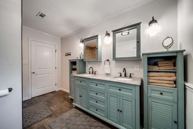 554 Hickman Shores Rd, Dover, TN 37058 - bathroom featuring double vanity, wood finished floors, and ornamental molding
