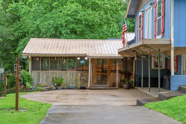 554 Hickman Shores Rd, Dover, TN 37058 - property entrance with a metal roof and driveway