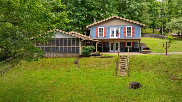 554 Hickman Shores Rd, Dover, TN 37058 - rear view of house with a sunroom, stairs, french doors, and a chimney