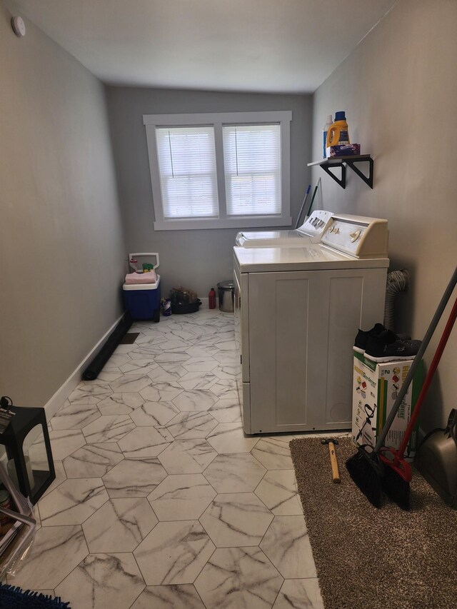 200 Church St, Loretto, TN 38469 - laundry area with separate washer and dryer and light marble finish flooring