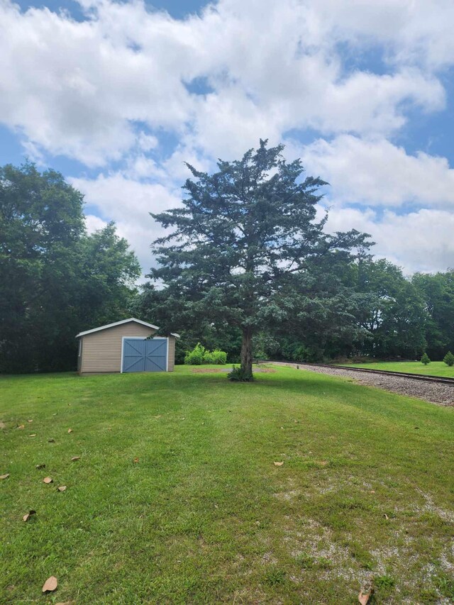 200 Church St, Loretto, TN 38469 - view of grassy yard with an outdoor structure and a pole building