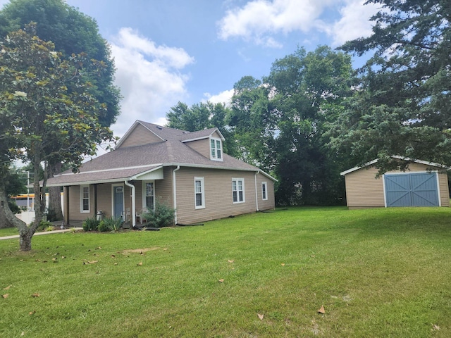 200 Church St, Loretto, TN 38469 - view of side of property featuring a yard, a storage unit, roof with shingles, and covered porch