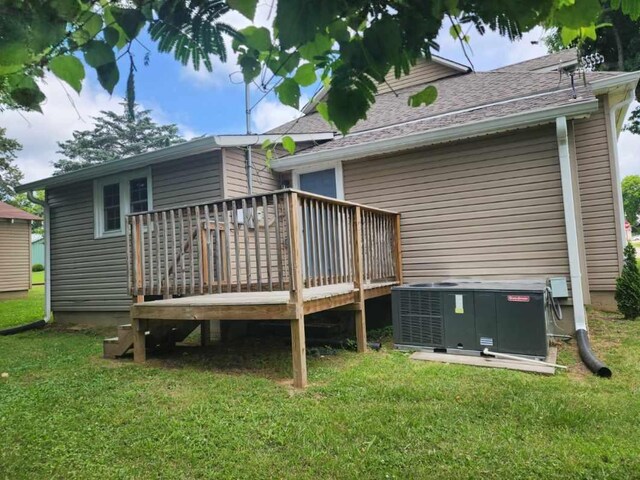 200 Church St, Loretto, TN 38469 - rear view of property featuring a deck, a lawn, and roof with shingles