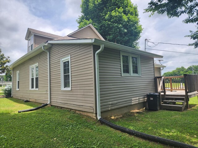 200 Church St, Loretto, TN 38469 - view of side of home with a deck and a lawn