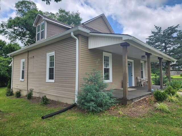 200 Church St, Loretto, TN 38469 - view of side of home featuring covered porch and a yard