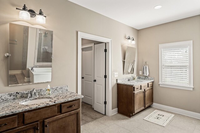 318 Finnhorse Ln, Franklin, TN 37064 - bathroom featuring two vanities, tiled shower, tile patterned floors, and a bathtub